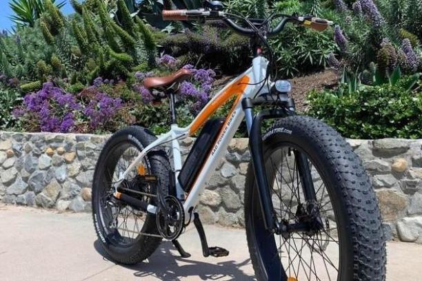 a bicycle is parked next to a stone wall