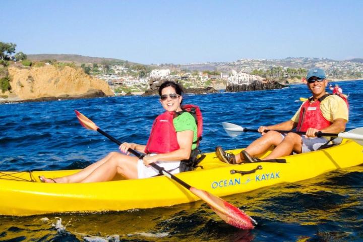 a group of people on a boat in the water