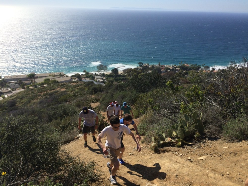 Hikers climbing hill at Top of the World